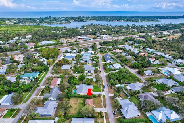 drone / aerial view with a water view