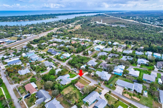 aerial view featuring a residential view and a water view