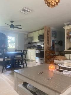 dining room featuring ceiling fan