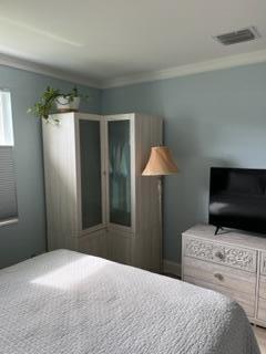 bedroom featuring ornamental molding