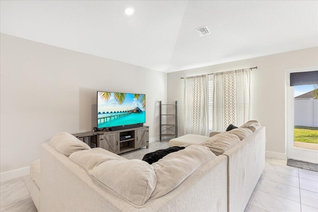 living room with lofted ceiling