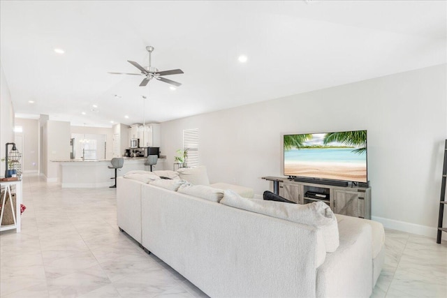 living room featuring ceiling fan