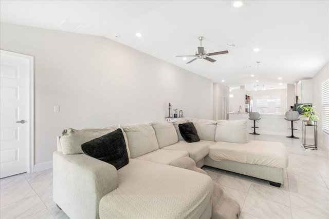 living room with vaulted ceiling and ceiling fan