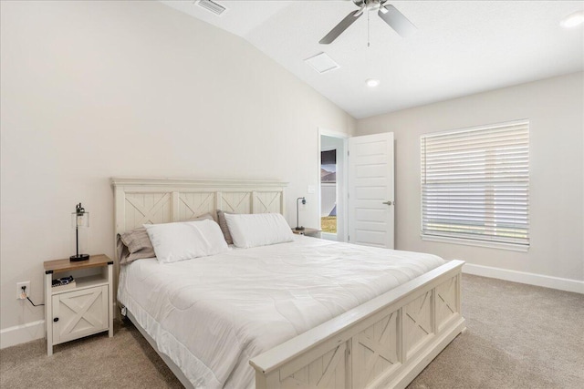 carpeted bedroom featuring lofted ceiling and ceiling fan