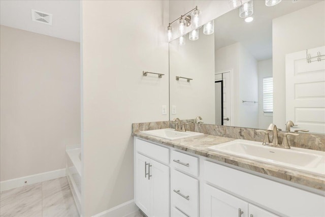 bathroom featuring vanity and a bathing tub