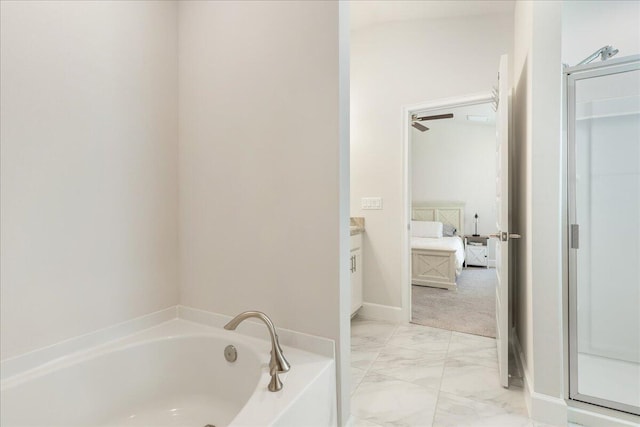 bathroom with vanity and a bath