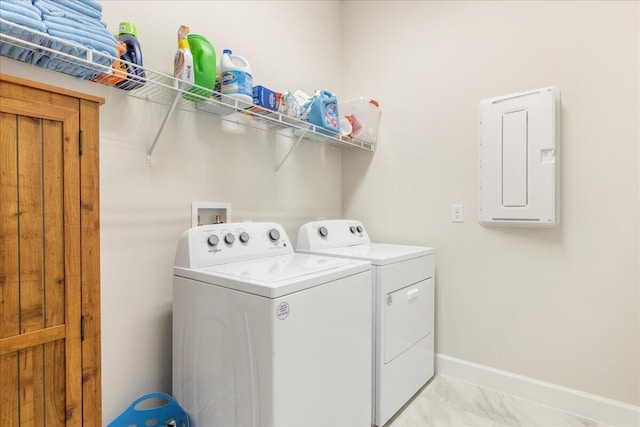 clothes washing area featuring washer and dryer