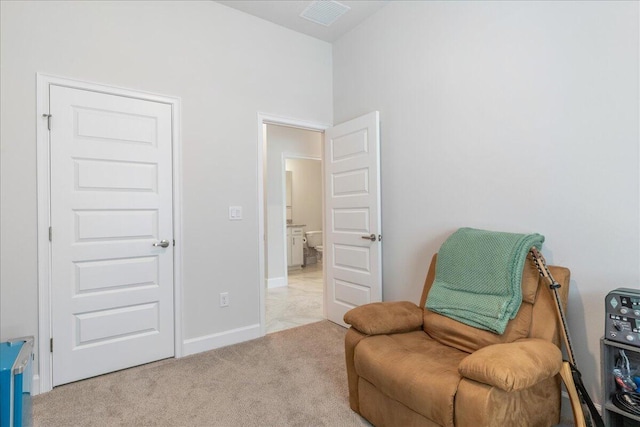 living area featuring light colored carpet