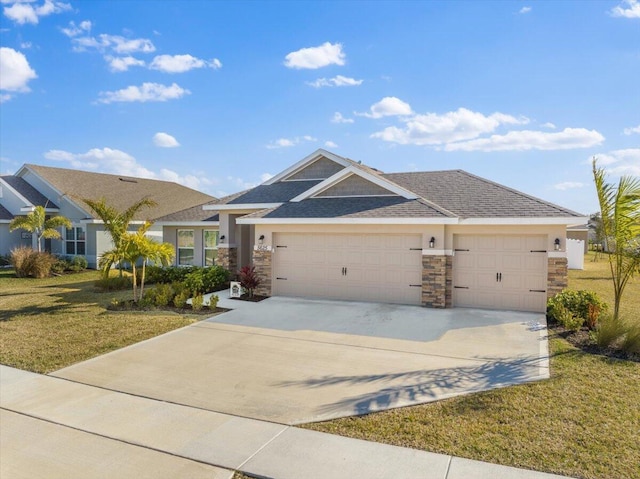 view of front of home featuring a garage and a front yard