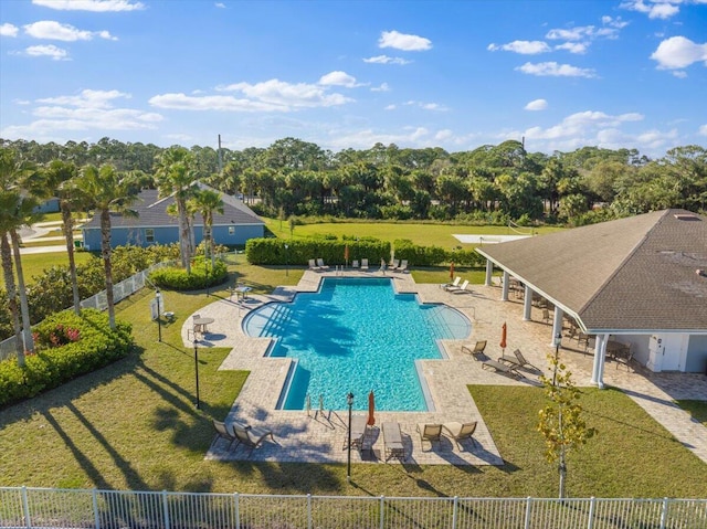 view of pool featuring a patio and a lawn