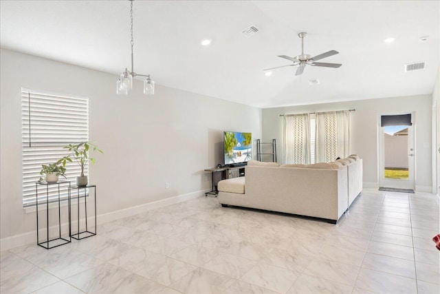 living room featuring vaulted ceiling and ceiling fan