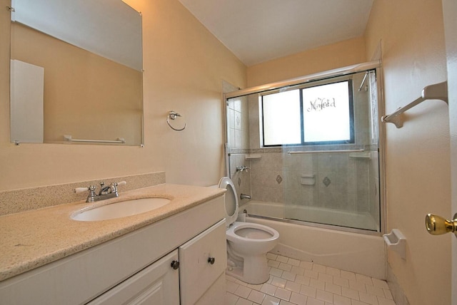 full bathroom featuring tile patterned flooring, bath / shower combo with glass door, vanity, and toilet