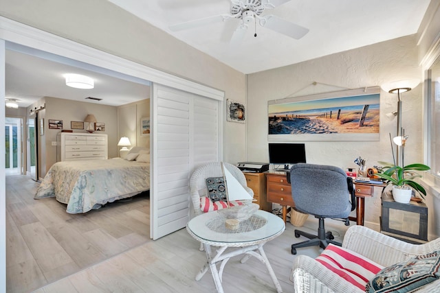 bedroom featuring ceiling fan and light hardwood / wood-style floors