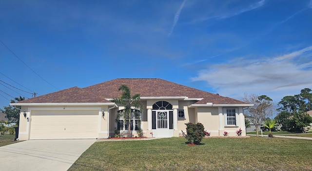 single story home with a garage and a front lawn