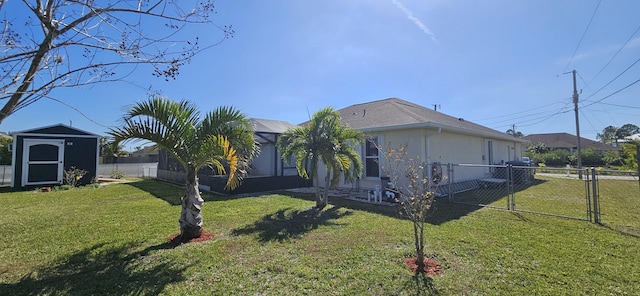 view of side of property featuring a shed and a lawn