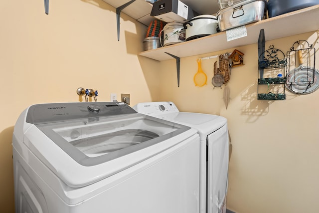 laundry room with separate washer and dryer