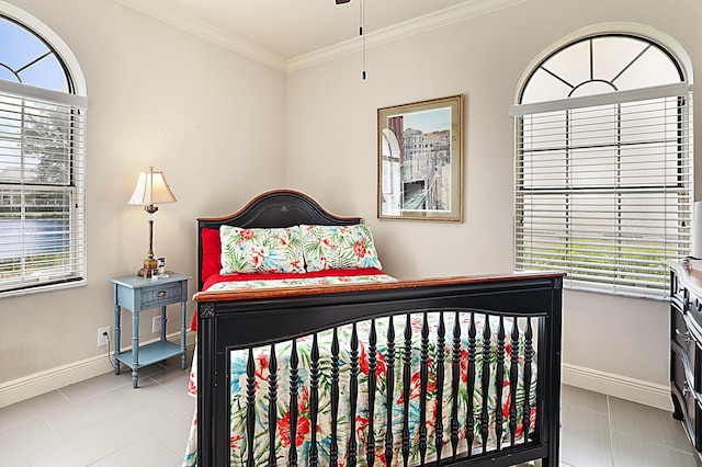 tiled bedroom featuring ornamental molding