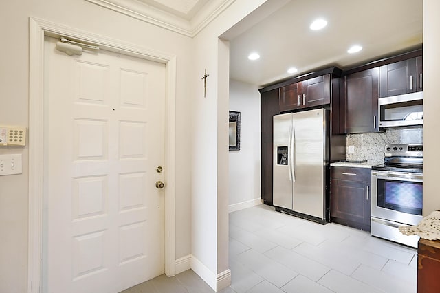 kitchen featuring dark brown cabinetry, backsplash, ornamental molding, and stainless steel appliances