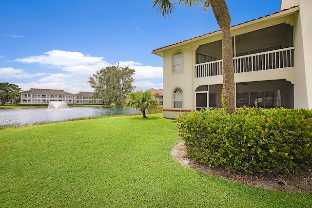 view of yard with a water view