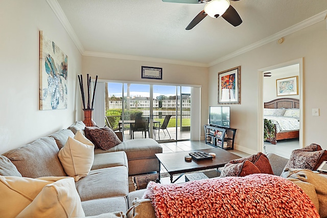 living room with ceiling fan, ornamental molding, a textured ceiling, and light tile patterned floors