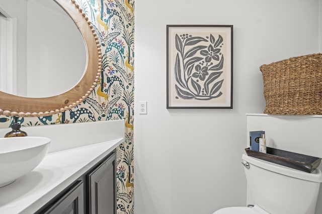 bathroom featuring vanity and toilet