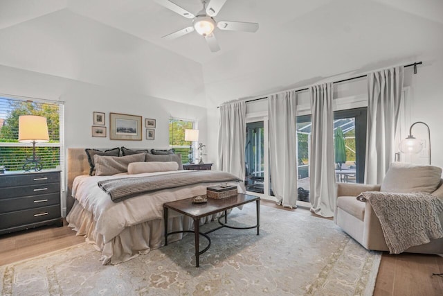 bedroom featuring multiple windows, access to outside, ceiling fan, and light hardwood / wood-style flooring