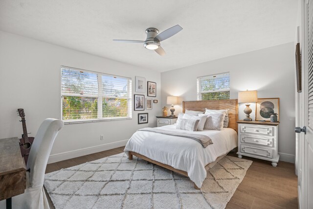 bedroom with hardwood / wood-style floors and ceiling fan