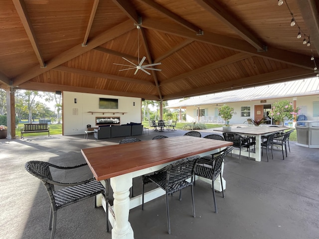 view of patio featuring a gazebo, ceiling fan, and an outdoor hangout area