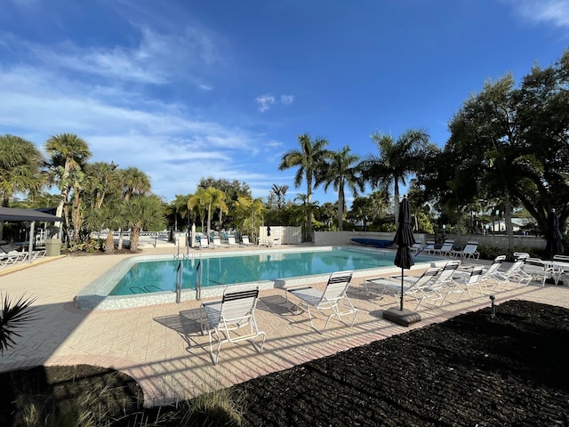 view of swimming pool featuring a patio area