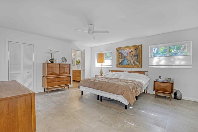 bedroom with connected bathroom, a closet, and ceiling fan