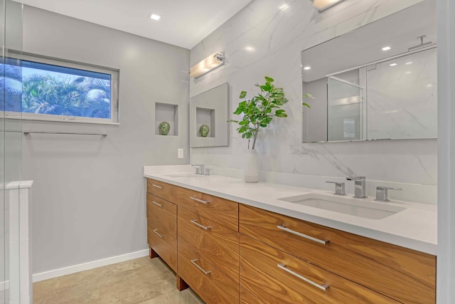 bathroom featuring vanity and a shower with shower door