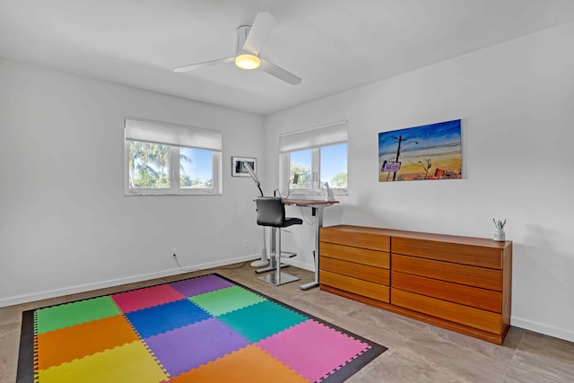 workout area featuring ceiling fan