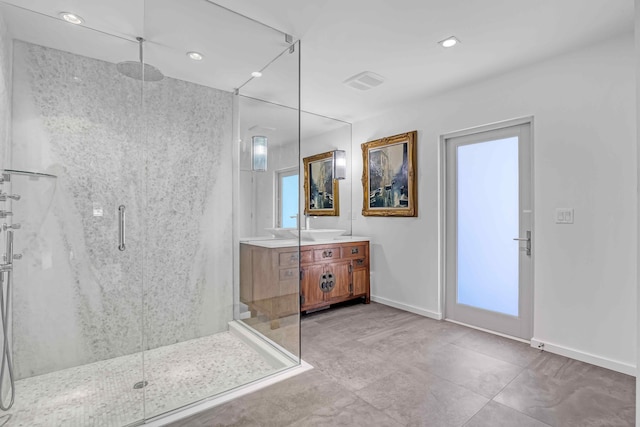 bathroom featuring vanity and an enclosed shower