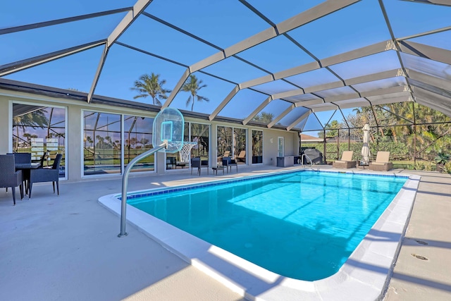 view of pool featuring a lanai and a patio area