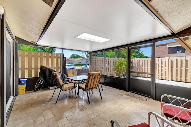 sunroom / solarium featuring a skylight