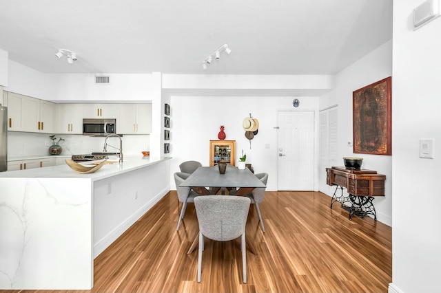 dining space featuring light hardwood / wood-style flooring