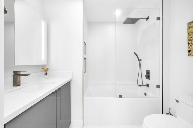 full bathroom with vanity, washtub / shower combination, and toilet