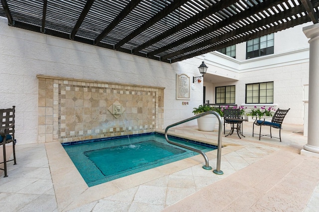 view of pool with a pergola and a patio area