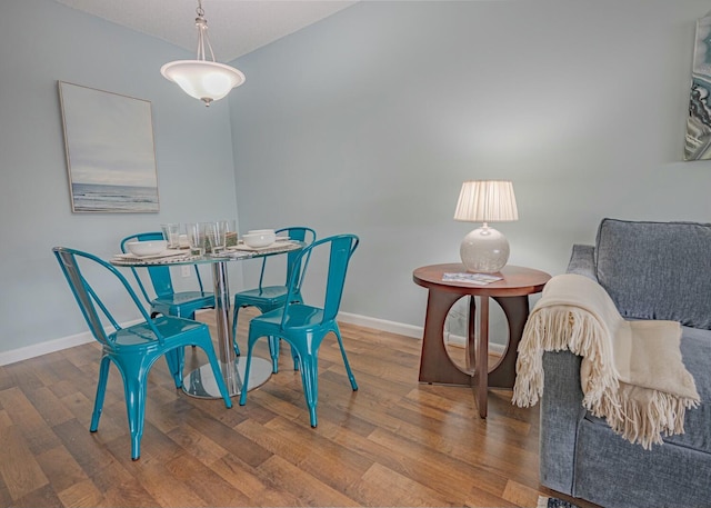 dining room with hardwood / wood-style flooring