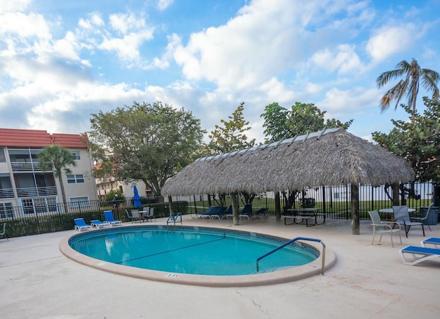 view of swimming pool with a patio area