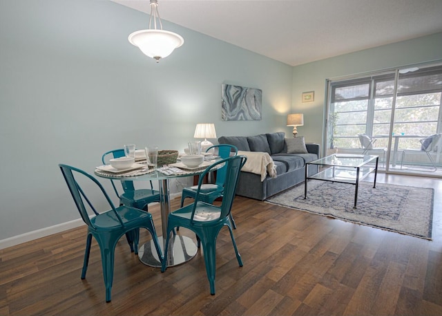 dining room with dark wood-type flooring