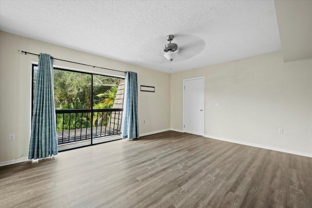 empty room with ceiling fan, a textured ceiling, and light wood-type flooring