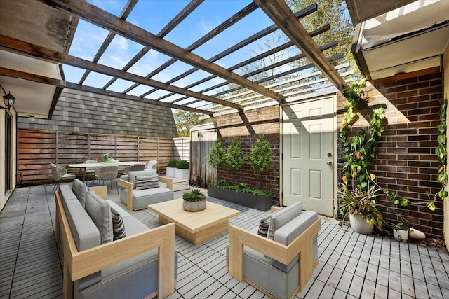 deck featuring an outdoor living space, a pergola, and a patio