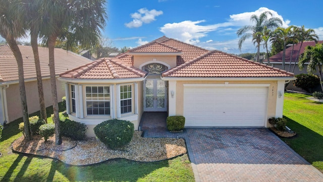 mediterranean / spanish-style house featuring a garage