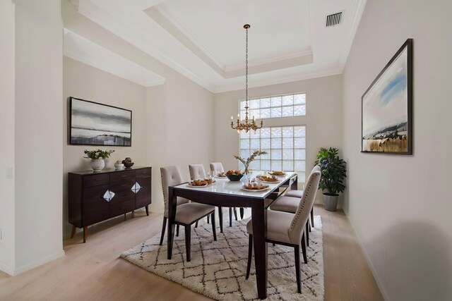 living room with light tile patterned floors, crown molding, ceiling fan, and a water view