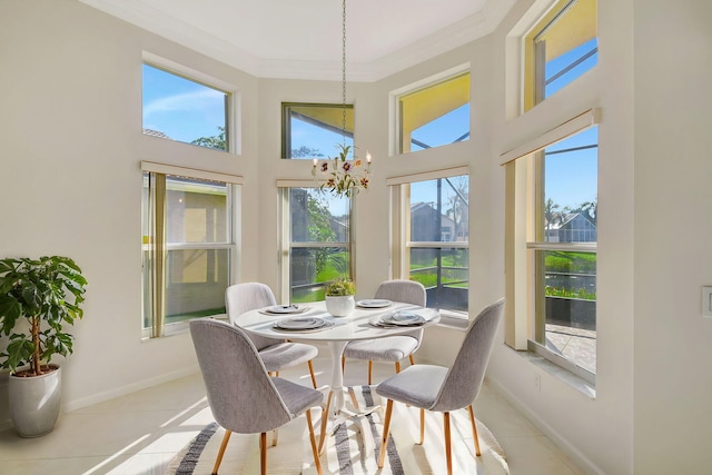 sunroom featuring a chandelier