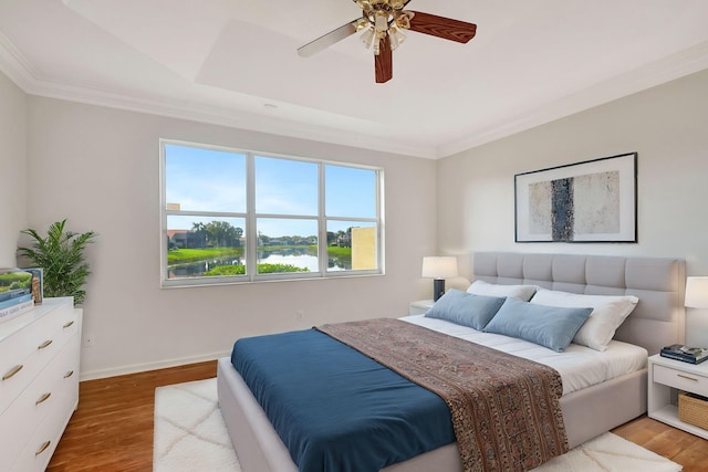 spare room featuring crown molding, ceiling fan, and light hardwood / wood-style flooring