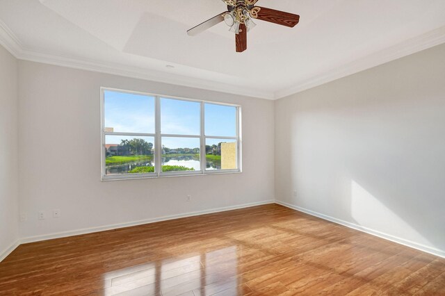 bedroom with crown molding, hardwood / wood-style flooring, and ceiling fan