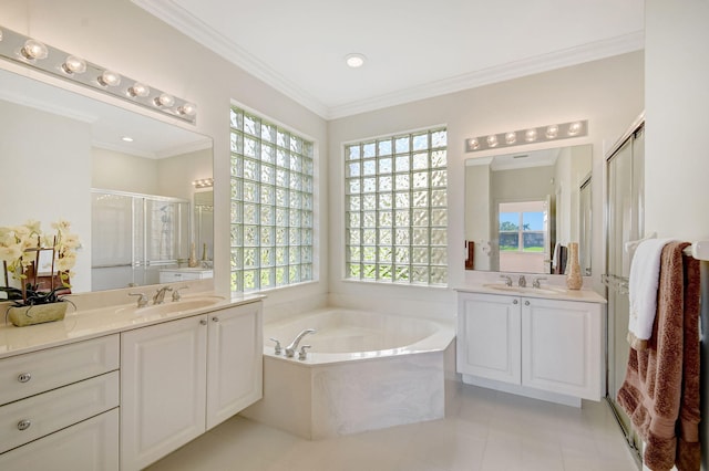 bathroom with a bath, crown molding, two vanities, a sink, and a stall shower