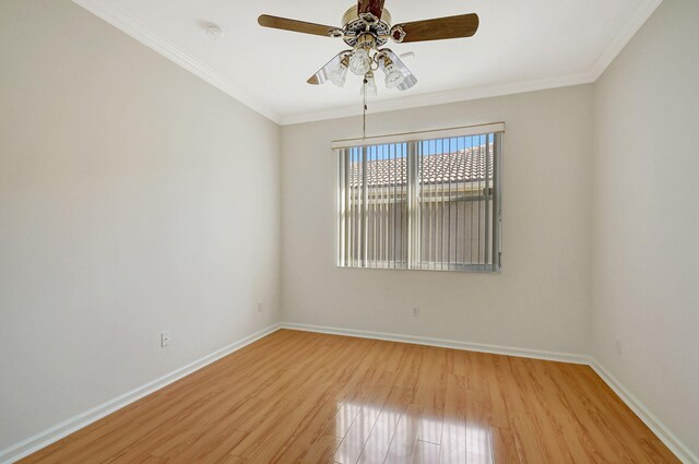 full bathroom featuring vanity, tiled shower / bath, crown molding, and toilet